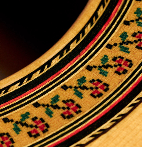 The close-up of a rosette of a 1996 Tezanos-Perez classical guitar made with Spruce and CSA rosewood