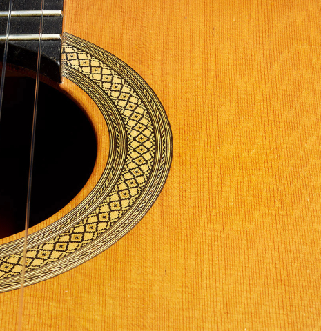 The soundboard and rosette of a 2002 Tezanos-Perez "Concierto" classical guitar made with cedar and CSA rosewood