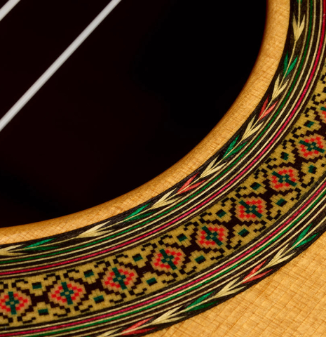 Closeup detail of the rosette of a 2010 Sergio Tezanos classical guitar made of spruce and maple