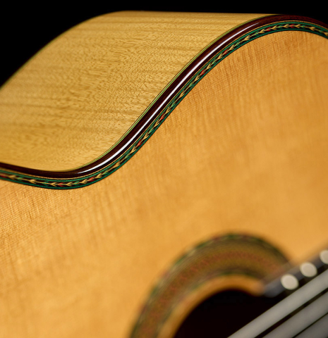 The soundboard and side of a 2010 Sergio Tezanos classical guitar made of spruce and maple