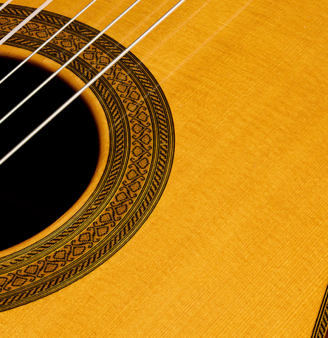 The soundboard and rosette detail of a 2007 Mariano Tezanos "Maestro" classical guitar made with spruce and CSA rosewood