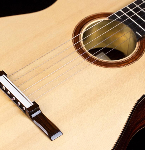 The soundboard of a 2017 Michael Thames "La Leona" classical guitar made of spruce and cocobolo