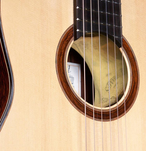 The top, rosette and tornavoz of a 2017 Michael Thames "La Leona" classical guitar made of spruce and cocobolo