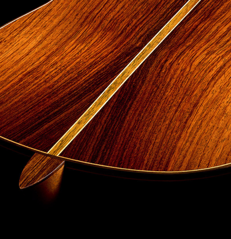 The heel, back binding and purfling of a 2018 Michael Thames classical guitar made of cedar and Indian rosewood