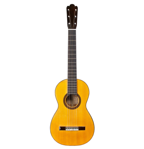 The front of an 1886 Antonio de Torres w/pegs classical guitar made of spruce and cypress