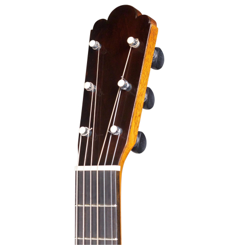 The headstock of an 1886 Antonio de Torres w/pegs classical guitar made of spruce and cypress