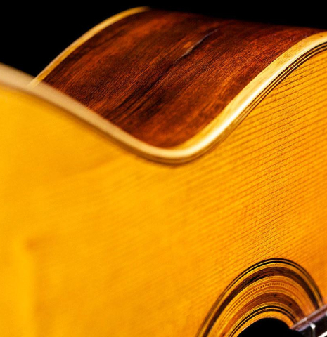 The front and side of an 1888 Antonio de Torres SP/MH SE 115 classical guitar.