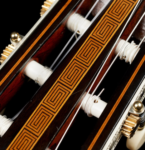The headstock inlay and tuning machines of a 1867 Antonio de Torres classical guitar made of spruce and maple