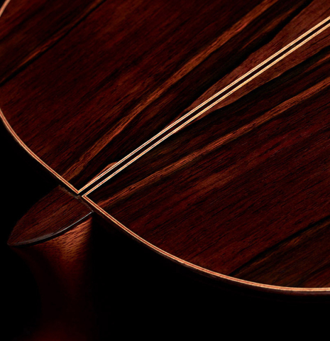 The heel of a 2016 Dake Traphagen made with cedar and CSA rosewood featuring traditional pegs.
