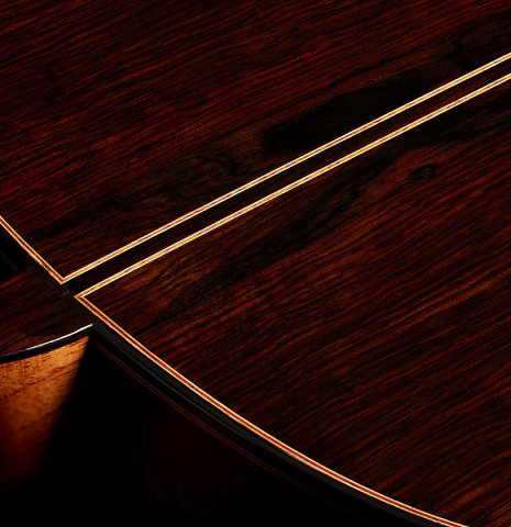 The heel, back binding and purflings of a 2023 Dake Traphagen classical guitar made of cedar and CSA rosewood