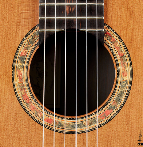 The rosette of a 2023 Dake Traphagen classical guitar made of cedar and CSA rosewood