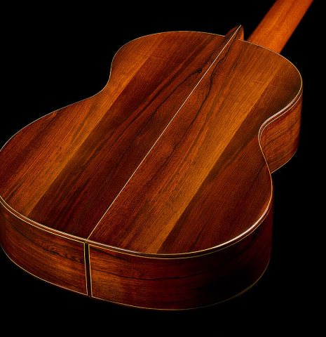 The back and sides of a 1981 Dake Traphagen classical guitar made of spruce and CSA rosewood