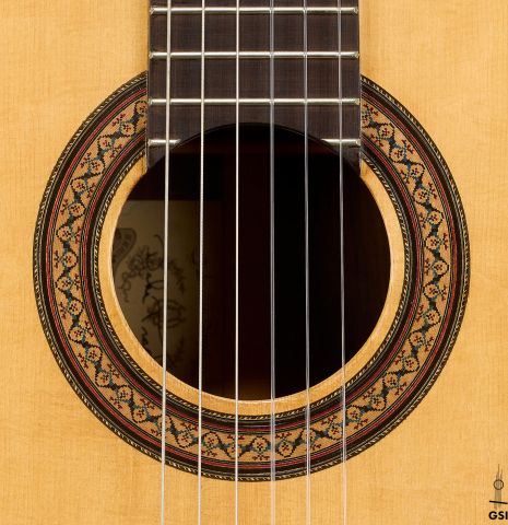 The rosette of a 1981 Dake Traphagen classical guitar made of spruce and CSA rosewood