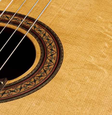 The top and rosette of a 1981 Dake Traphagen classical guitar made of spruce and CSA rosewood