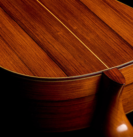 The neck joint, heel, back binding and purfling of a 2005 Dake Traphagen classical guitar made of spruce and African rosewood