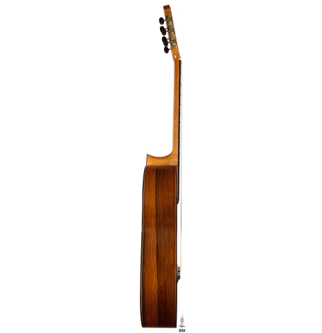 The side of a 2005 Dake Traphagen classical guitar made of spruce and African rosewood