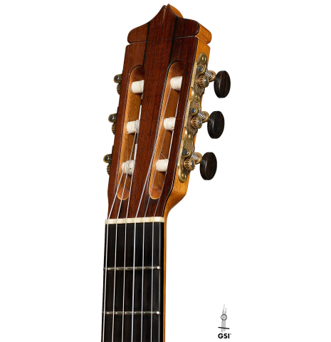 The headstock of a 2005 Dake Traphagen classical guitar made of spruce and African rosewood
