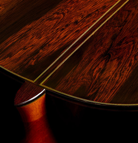 The heel, back binding and purfling of a 2024 Oscar Trezzini "Friederich/Lagoya" classical guitar made of spruce and CSA rosewood