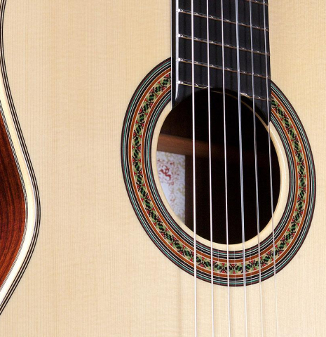 The soundboard and rosette of a Wataru Tsuji "S-2" SP/IN made with spruce top and Indian rosewood back and sides