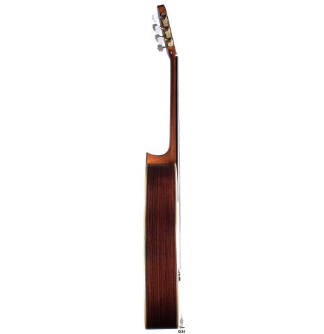 The side of a Wataru Tsuji "S-2" SP/IN made with spruce top and Indian rosewood back and sides on a white background
