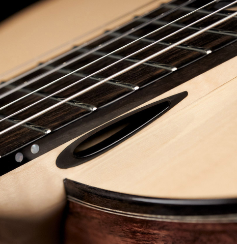The wave resonator of a 2019 Rafal Turkowiak classicalg guitar made with spruce top and Makassar Ebony back and sides.