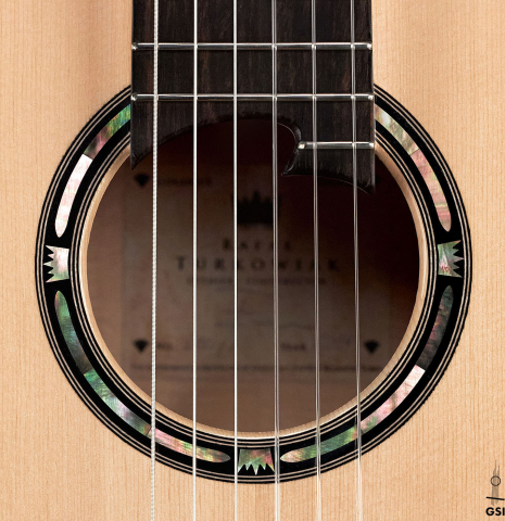 The rosette of a 2019 Rafal Turkowiak classicalg guitar made with spruce top and Makassar Ebony back and sides.