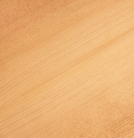 This is a closeup of the cypress back of a 2020 Mark Usherovich w/pegs classical guitar made with spruce top and cypress back and sides