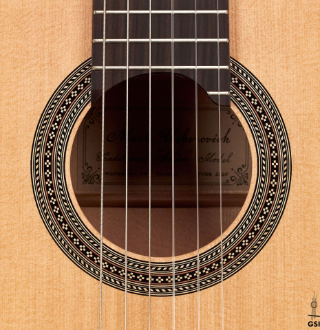 This is the rosette of a 2020 Mark Usherovich w/pegs classical guitar made with spruce top and cypress back and sides