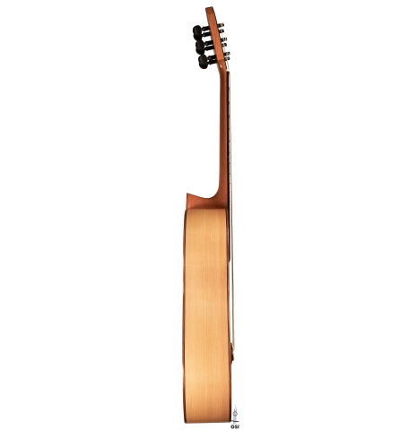 This is the cypress side of a 2020 Mark Usherovich w/pegs classical guitar on a white background.