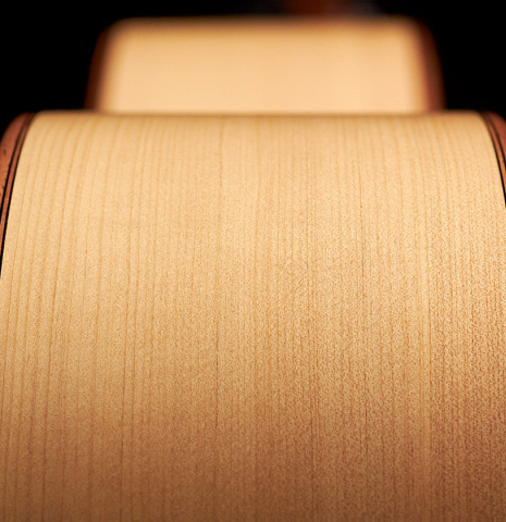 This is a sideview of the ribs of a 2020 Mark Usherovich w/pegs classical guitar made with spruce top and cypress back and sides