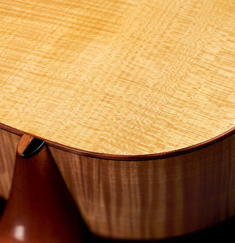 This is a closeup of the maple back of a 2022 Mark Usherovich "Romantic" classical guitar made with spruce top and maple back and sides