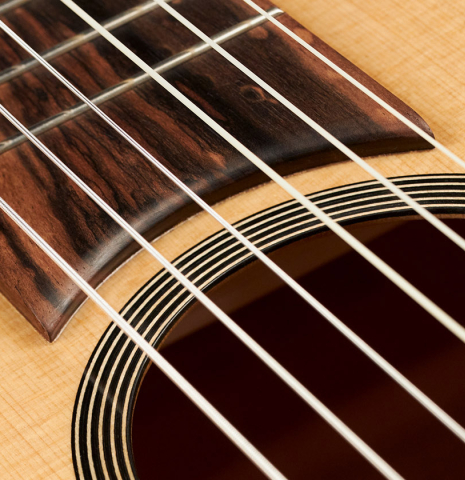 This is a close-up of the rosette of a 2022 Mark Usherovich "Romantic" classical guitar made with spruce top and maple back and sides