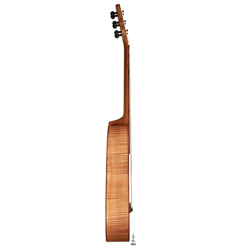 This is the maple side of a 2022 Mark Usherovich "Romantic" classical guitar on a white background.