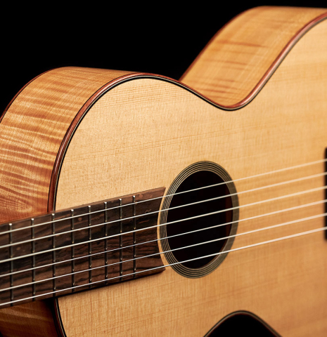 This is the front and sides of a 2022 Mark Usherovich "Romantic" classical guitar made with spruce top and maple back and sides