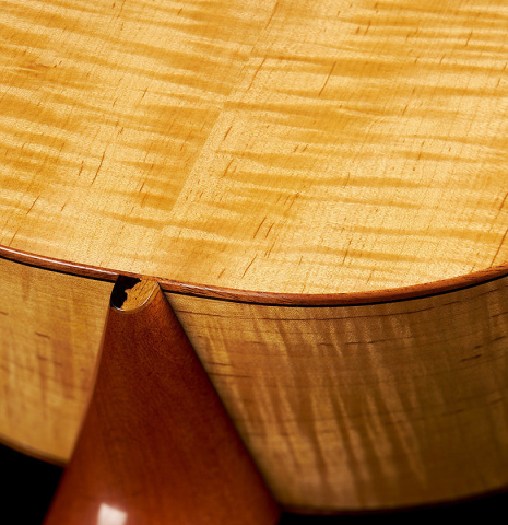 The back, sides and heel of a 2024 Mark Usherovich "Romantic" classical guitar made of spruce and maple