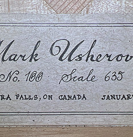 The label of a 2024 Mark Usherovich "Romantic" classical guitar made of spruce and maple