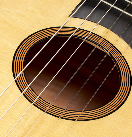 Closeup of the rosette of a 2024 Mark Usherovich "Romantic" classical guitar made of spruce and maple