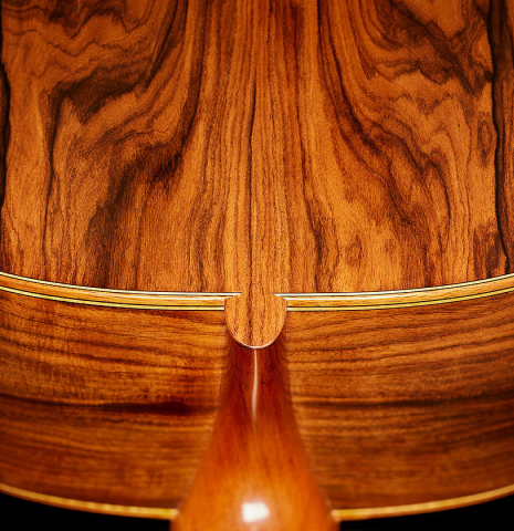 The heel, back binding and purfling of a 2023 Mark Usherovich "Lattice" classical guitar made of spruce and pau ferro