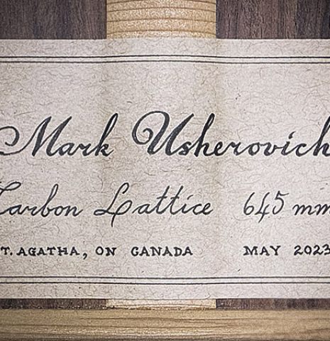 The label of a 2023 Mark Usherovich "Lattice" classical guitar made of spruce and pau ferro