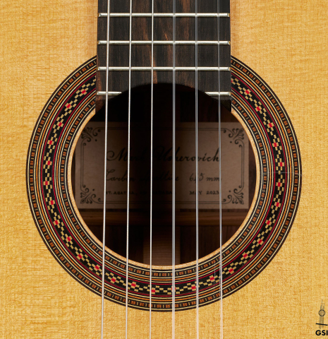 The rosette of a 2023 Mark Usherovich "Lattice" classical guitar made of spruce and pau ferro