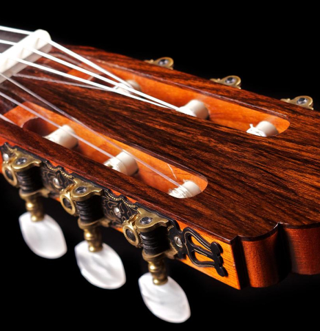 The headstock and tuning machines of a 1978 Manuel Velazquez classical guitar made of cedar and Indian rosewood
