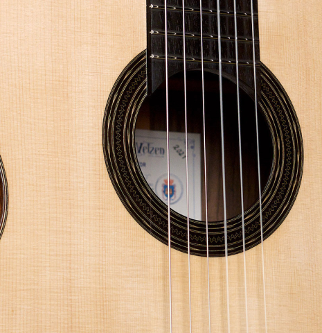 The soundboard and rosette of a 2021 Hans van Velzen "1917 Garcia" classical guitar made with Spruce and Indian rosewood