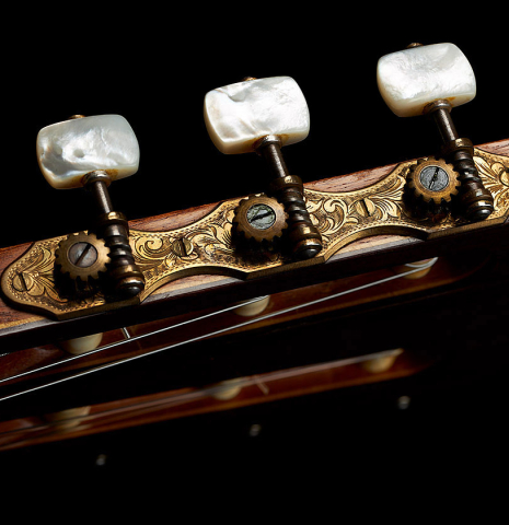 The headstock and tuning machines of a 1955 Manuel Velazquez classical guitar made of spruce and CSA rosewood