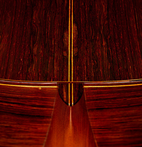 The heel, back binding and purfling of a 1960 Manuel Velazquez classical guitar made of spruce and CSA rosewood