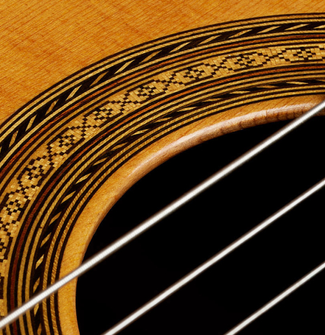 Closeup detail of the rosette of a 1960 Manuel Velazquez classical guitar made of spruce and CSA rosewood