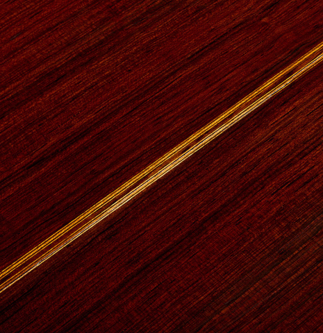 The back center seam of a 1958 Manuel Velazquez classical guitar made of spruce and CSA rosewood