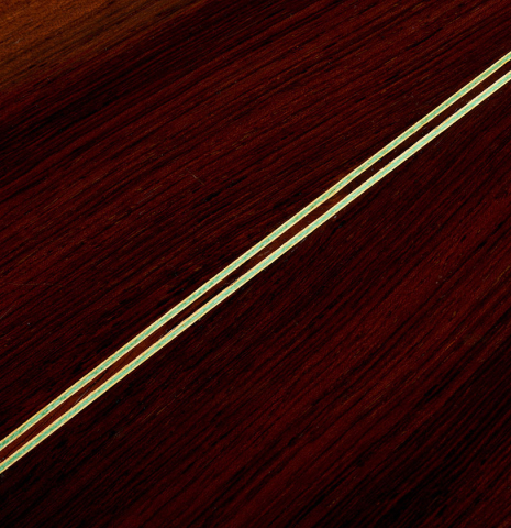 The back center seam of a 1951 Manuel Velazquez classical guitar made of spruce and CSA rosewood
