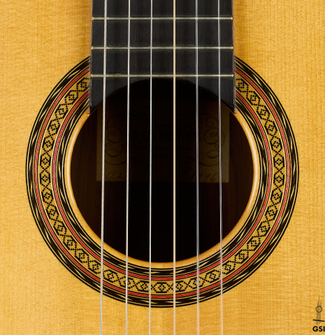The rosette of a 1996 Manuel Velazquez classical guitar made of spruce and CSA rosewood