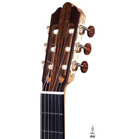This is the headstock of a Jose Vigil classical guitar built in 2018 on a white background. It has a spruce soundboard and CSA rosewood back and sides.