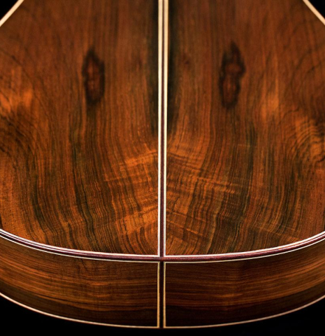 This is a detail of the back of a Jose Vigil classical guitar built in 2018. It has a spruce soundboard and CSA rosewood back and sides.